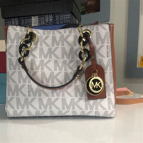 is michael kors real leather|Michael Kors knock offs.